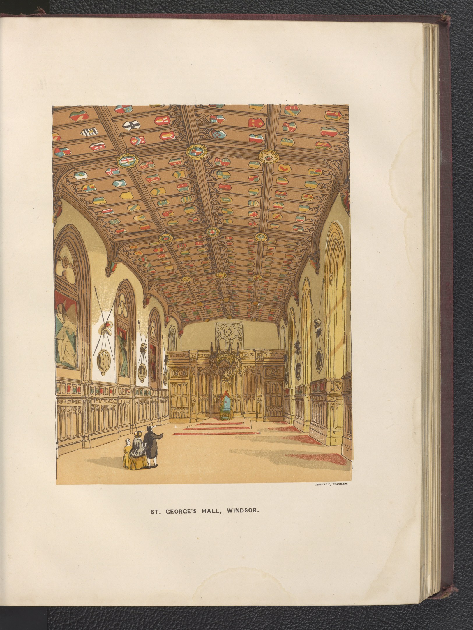 Offenes Buch mit einer detaillierten Illustration des Inneren von St. George's Hall in Windsor, England, mit sichtbaren architektonischen Elementen und Figuren, das auf einer schwarzen Oberfläche liegt.