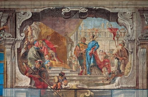 Ein lebendiges und detailliertes Deckengemälde, das eine Gruppe von Menschen in verschiedener Kleidung zeigt, umgeben von Skulpturen und Gegenständen, die eine Bewegung und Leben vermitteln.