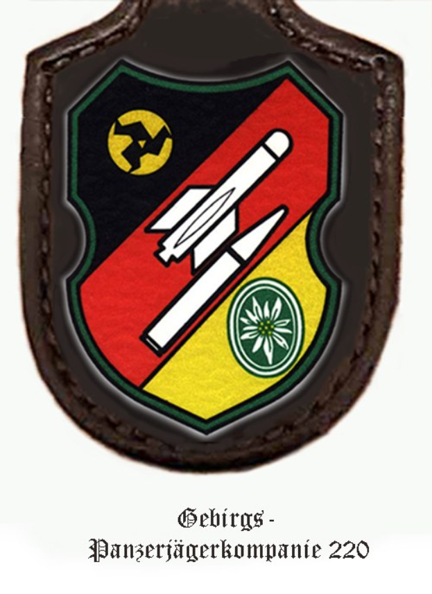 Logo der Gebirgs-Panzerjägerkompanie 220 der deutschen Luftstreitkräfte mit einem roten Schild, einem weißen Stern und einem schwarz-weißen Karomuster sowie schwarzer, fetter Schrift unten.