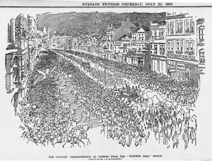 Schwarze und weiße Zeichnung einer Menge, die eine Straße zwischen Gebäuden entlang geht, mit Text oben und unten, der "Die Unionistendemonstration aus der Sicht des Western Mail Office" lautet.